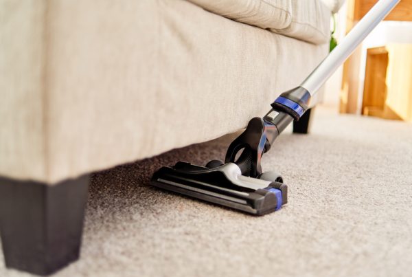 Cleaning Beige Carpet Using Vacuum
